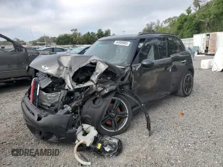 2015 MINI Countryman S with VIN WMWZC3C57FWP52868, listed as a Copart auction lot 54909085 with 68,003 mi miles and Salvage title. Bid and sale history available at DreamBid. Image 1.