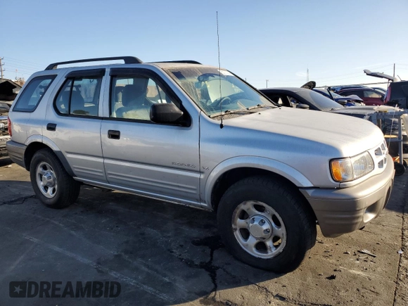 2000 Isuzu Rodeo S z VIN 4S2CK58W2Y4311726, wystawiony jako Copart lot #85070364 z przebiegiem 226 510 mil mil oraz Szkody całkowita. Historia ofert i sprzedaży dostępna na DreamBid. Obrazek 4.