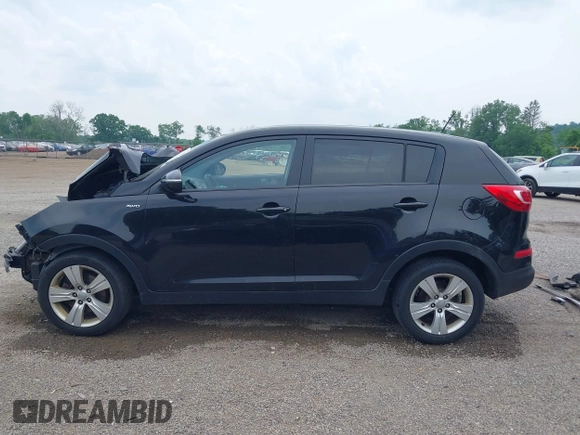2013 Kia Sportage LX z VIN KNDPBCA28D7411444, wystawiony jako IAAI lot #42415041 z przebiegiem 150 524 mil mil oraz . Historia ofert i sprzedaży dostępna na DreamBid. Obrazek 15.