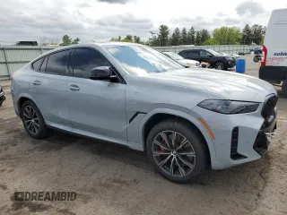 2025 BMW X6 M60i with VIN 5UX43EX06S9W68023, listed as a Copart auction lot 69874764 with 3,789 mi miles and Salvage Title. Bid and sale history available at carsss.com. Image 4.