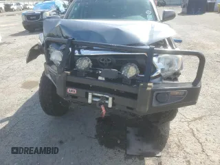 2014 Toyota Tacoma with VIN 3TMLU4EN2EM163797, listed as a Copart auction lot 61078805 with 130,748 mi miles and Salvage title. Bid and sale history available at DreamBid. Image 12.