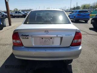 2003 Mazda Protege DX with VIN JM1BJ225730217866, listed as a Copart auction lot 53854075 with 105,782 mi miles and Salvage Title. Bid and sale history available at DreamBid. Image 6.