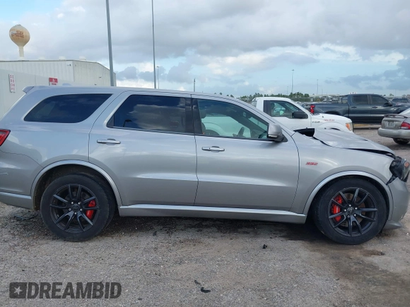2018 Dodge Durango SRT with VIN 1C4SDJGJ5JC256006, listed as a IAAI auction lot 41038356 with 71,385 mi miles and . Bid and sale history available at DreamBid. Image 13.