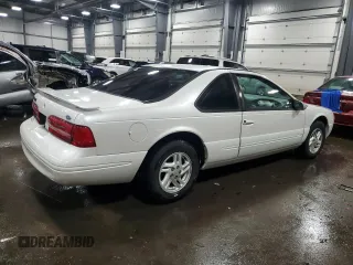 1997 Ford Thunderbird LX with VIN 1FALP6249VH167869, listed as a Copart auction lot 86851434 with 40,490 mi miles and Salvage Title. Bid and sale history available at DreamBid. Image 3.