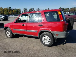 2000 Honda CR-V LX with VIN JHLRD1843YC063597, listed as a Copart auction lot 77765884 with 310,685 mi miles and Salvage Title. Bid and sale history available at carsss.com. Image 2.