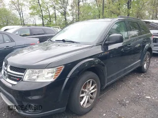 2016 Dodge Journey SXT with VIN 3C4PDCBG2GT100550, listed as a IAAI auction lot 41982670 with 184,601 mi miles. Bid and sale history available at carsss.com. Image 2.