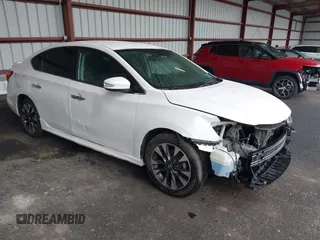 2019 Nissan Sentra S z VIN 3N1AB7AP0KY210693, wystawiony jako IAAI lot #42181359 z przebiegiem 121 573 mil mil oraz . Historia ofert i sprzedaży dostępna na DreamBid. Obrazek 1.