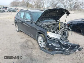 2015 BMW X1 xDrive28i with VIN WBAVL1C57FVY28954, listed as a IAAI auction lot 41857286 with 1 mi miles. Bid and sale history available at carsss.com. Image 1.