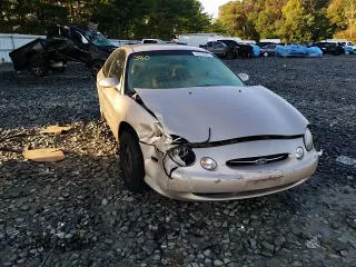 1999 Ford Taurus SE z VIN 1FAFP53U9XG107489, wystawiony jako Copart lot #69576093 z przebiegiem 86 262 mil mil oraz Szkody całkowita. Historia ofert i sprzedaży dostępna na DreamBid. Obrazek 11.