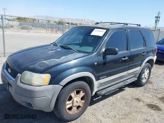 2001 Ford Escape XLT with VIN 1FMYU03141KF43980, listed as a IAAI auction lot 41989002 with 222,344 mi miles. Bid and sale history available at carsss.com. Image 2.
