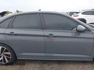 2021 Volkswagen Jetta GLI S with VIN 3VW6T7BU8MM011418, listed as a IAAI auction lot 40474082 with 76,619 mi miles and . Bid and sale history available at DreamBid. Image 14.