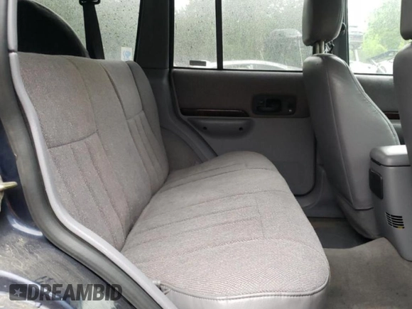 1997 Jeep Cherokee Country with VIN 1J4FJ78S4VL589852, listed as a Copart auction lot 56294015 with 189,530 mi miles and Salvage title. Bid and sale history available at DreamBid. Image 11.