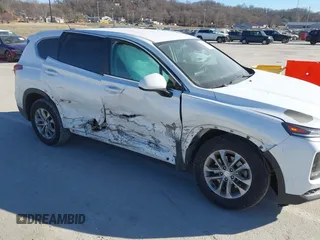 2019 Hyundai Santa Fe SE with VIN 5NMS2CAD4KH118545, listed as a IAAI auction lot 41686797 with 54,108 mi miles and . Bid and sale history available at DreamBid. Image 6.