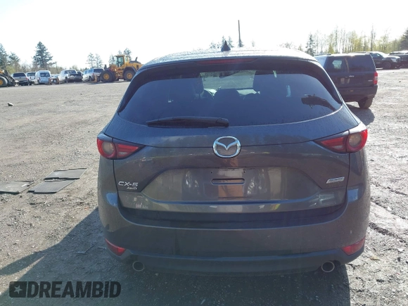 2019 Mazda CX-5 Grand Touring with VIN JM3KFBDM3K1677208, listed as a IAAI auction lot 41929299 with 58,163 mi miles. Bid and sale history available at carsss.com. Image 16.