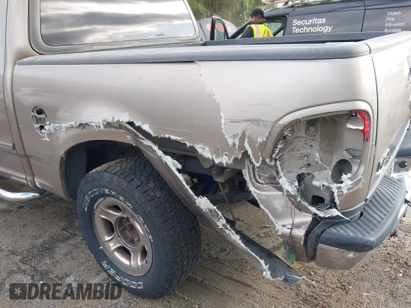 2003 Ford F-150 XLT with VIN 1FTRW07623KD34295, listed as a IAAI auction lot 41515387 with 163,506 mi miles. Bid and sale history available at carsss.com. Image 6.
