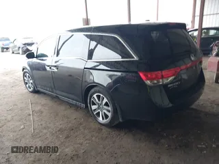 2014 Honda Odyssey Touring with VIN 5FNRL5H98EB095835, listed as a IAAI auction lot 42153412 with 124,131 mi miles and . Bid and sale history available at DreamBid. Image 3.