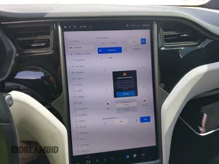 2021 Tesla Model X Long Range Plus with VIN 5YJXCBE23MF321243, listed as a IAAI auction lot 42100580 with 59,878 mi miles and . Bid and sale history available at carsss.com. Image 18.