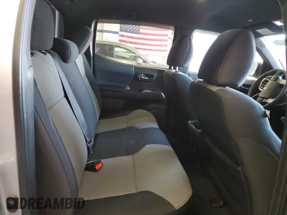 2023 Toyota Tacoma SR5 z VIN 3TMDZ5BNXPM165719, wystawiony jako Copart lot #58256035 z przebiegiem 13 681 mil mil oraz Szkoda całkowita • Salvage title. Historia ofert i sprzedaży dostępna na DreamBid. Obrazek 10.