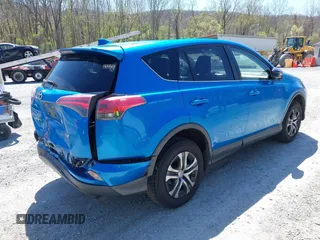 2018 Toyota RAV4 LE with VIN JTMZFREV4JJ734702, listed as a IAAI auction lot 41987540 with 141,526 mi miles. Bid and sale history available at carsss.com. Image 4.