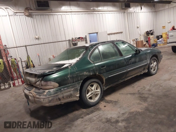 1997 Pontiac Bonneville SE z VIN 1G2HX52KXVH250272, wystawiony jako IAAI lot #41644041 z przebiegiem 160 791 mil mil oraz . Historia ofert i sprzedaży dostępna na DreamBid. Obrazek 4.