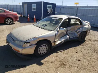 1994 Honda Accord LX with VIN 1HGCD5631RA137411, listed as a Copart auction lot 76126484 with 212,681 mi miles and Salvage Title. Bid and sale history available at carsss.com. Image 1.