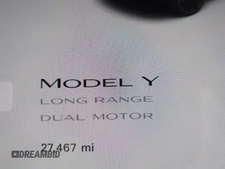 2023 Tesla Model Y Long Range with VIN 7SAYGAEEXPF707503, listed as a IAAI auction lot 41712166 with 27,467 mi miles and . Bid and sale history available at carsss.com. Image 15.