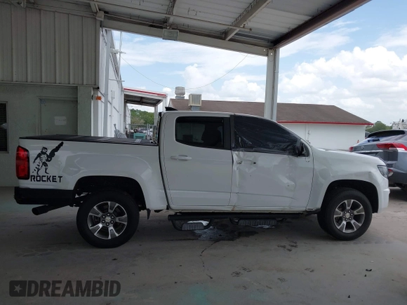 2020 Chevrolet Colorado 2WD Z71 with VIN 1GCGSDEN2L1159458, listed as a IAAI auction lot 42412924 with 90,011 mi miles and . Bid and sale history available at DreamBid. Image 14.