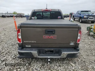 2016 GMC Canyon 4WD SLE z VIN 1GTG6CE38G1303839, wystawiony jako Copart lot #57387295 z przebiegiem 87 945 mil mil oraz Nie do naprawy. Historia ofert i sprzedaży dostępna na DreamBid. Obrazek 6.