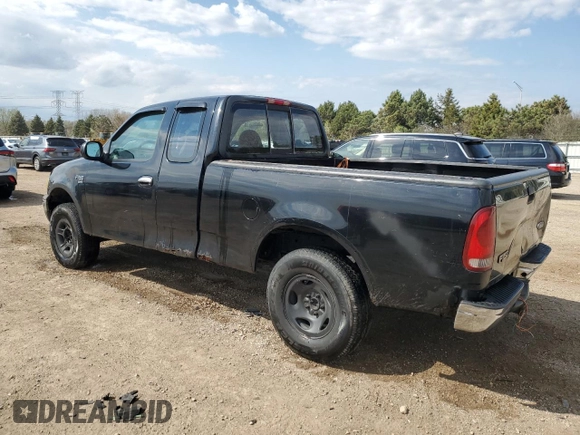 1999 Ford F-150 with VIN 1FTRX18W1XKC00918, listed as a Copart auction lot 53830305 with 205,205 mi miles and Salvage title. Bid and sale history available at DreamBid. Image 2.