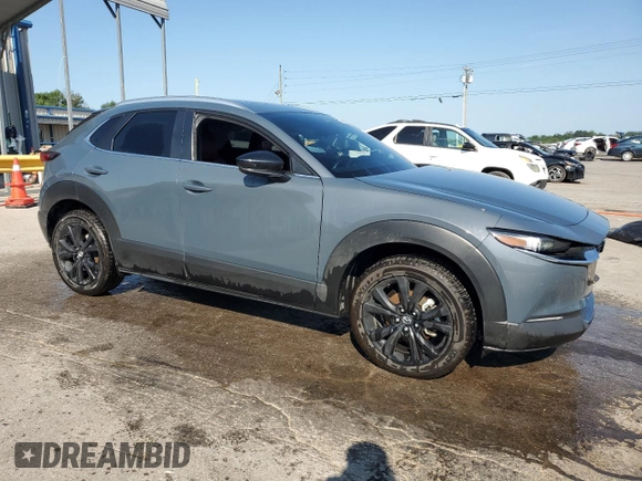 2023 Mazda CX-30 S Carbon Edition with VIN 3MVDMBCM1PM553374, listed as a Copart auction lot 62080975 with 51,527 mi miles and Salvage title. Bid and sale history available at DreamBid. Image 4.