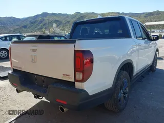 2023 Honda Ridgeline Sport z VIN 5FPYK3F13PB060341, wystawiony jako IAAI lot #41955592 z przebiegiem 27 927 mil mil oraz . Historia ofert i sprzedaży dostępna na DreamBid. Obrazek 4.