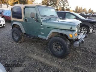 2000 Jeep Wrangler Sport with VIN 1J4FA49S1YP748529, listed as a Copart auction lot 77041924 with 154,949 mi miles and Salvage Title. Bid and sale history available at carsss.com. Image 4.