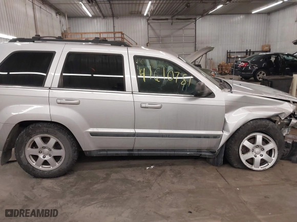 2009 Jeep Grand Cherokee Laredo with VIN 1J8GR48KX9C516873, listed as a IAAI auction lot 41610781 with 199,246 mi miles. Bid and sale history available at carsss.com. Image 13.