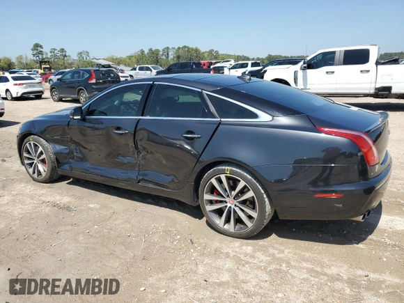 2013 Jaguar XJ with VIN SAJWA3HE9DMV49768, listed as a Copart auction lot 50339955 with 56,841 mi miles and Salvage Title. Bid and sale history available at DreamBid. Image 2.