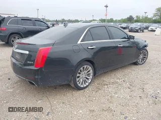 2014 Cadillac CTS Luxury AWD with VIN 1G6AX5SX9E0197395, listed as a IAAI auction lot 42211452 with 90,657 mi miles and . Bid and sale history available at DreamBid. Image 4.