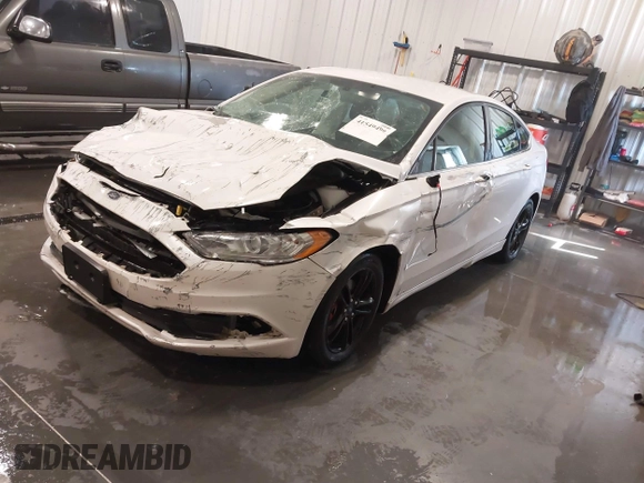 2018 Ford Fusion SE z VIN 3FA6P0HD9JR231970, wystawiony jako IAAI lot #41549490 z przebiegiem 99 803 mil mil oraz . Historia ofert i sprzedaży dostępna na DreamBid. Obrazek 21.