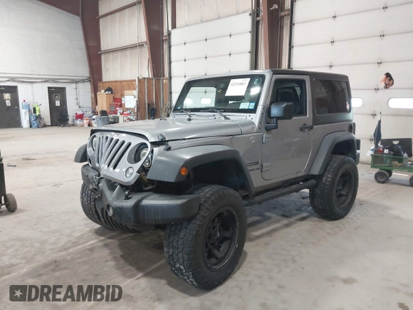 2014 Jeep Wrangler Sport with VIN 1C4AJWAG0EL173362, listed as a IAAI auction lot 42231863 with 99,321 mi miles and . Bid and sale history available at DreamBid. Image 2.