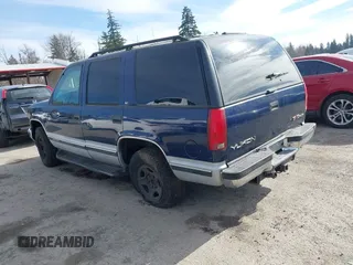 1997 GMC Yukon with VIN 1GKEK13R8VJ737324, listed as a IAAI auction lot 41675479 with 237,223 mi miles. Bid and sale history available at carsss.com. Image 3.