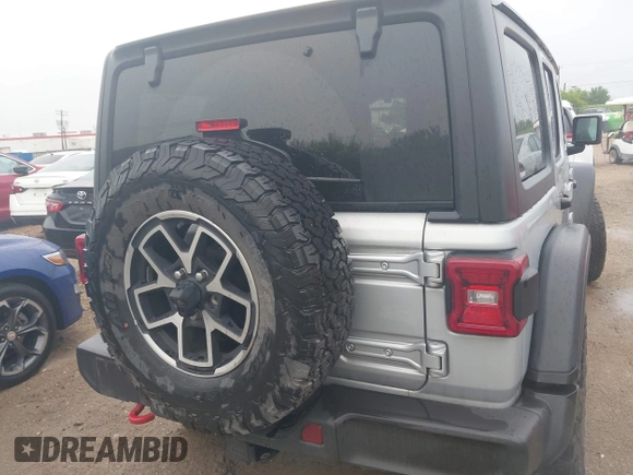 2024 Jeep Wrangler Rubicon with VIN 1C4PJXFG7RW252959, listed as a IAAI auction lot 41955302 with 27,727 mi miles and . Bid and sale history available at DreamBid. Image 16.