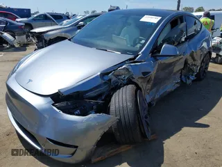 2024 Tesla Model Y Performance with VIN 7SAYGDEF9RA299036, listed as a IAAI auction lot 42140788 with 14,844 mi miles and . Bid and sale history available at DreamBid. Image 2.