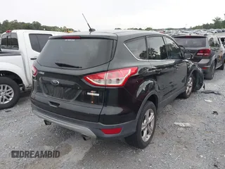 2014 Ford Escape SE with VIN 1FMCU0GX9EUB21853, listed as a IAAI auction lot 40313063 with 106,687 mi miles. Bid and sale history available at carsss.com. Image 4.