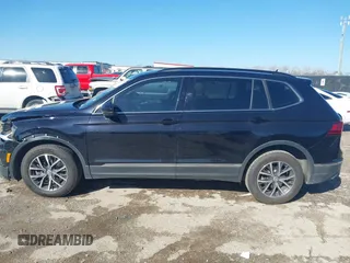 2020 Volkswagen Tiguan SE with VIN 3VV3B7AX0LM106561, listed as a IAAI auction lot 41712689 with 85,374 mi miles and . Bid and sale history available at DreamBid. Image 15.