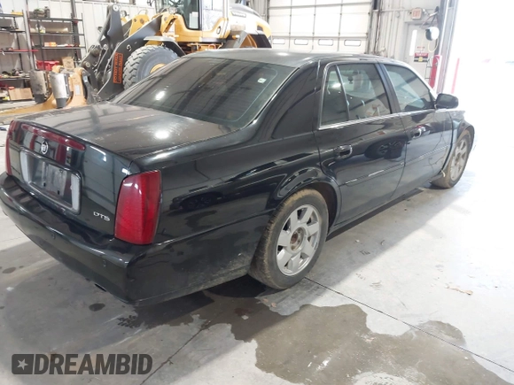 2002 Cadillac DeVille DTS with VIN 1G6KF579X2U141648, listed as a IAAI auction lot 42059624 with 179,338 mi miles. Bid and sale history available at carsss.com. Image 4.