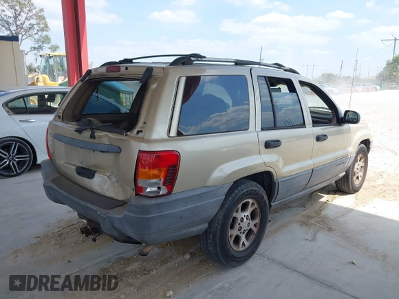 2001 Jeep Grand Cherokee Laredo with VIN 1J4GX48S81C589400, listed as a IAAI auction lot 42091559 with 219,698 mi miles and . Bid and sale history available at DreamBid. Image 4.