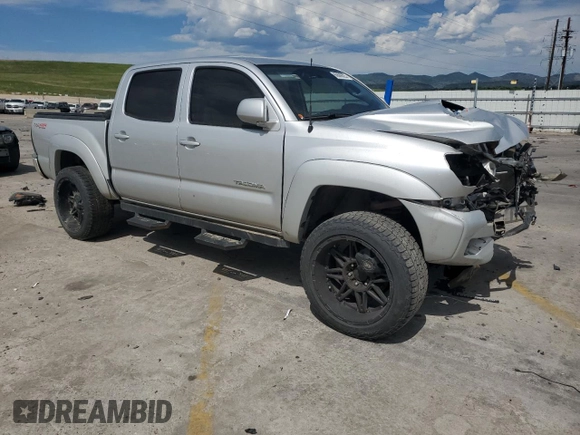 2012 Toyota Tacoma with VIN 5TFLU4ENXCX027960, listed as a Copart auction lot 60689025 with 209,480 mi miles and Salvage title. Bid and sale history available at DreamBid. Image 4.