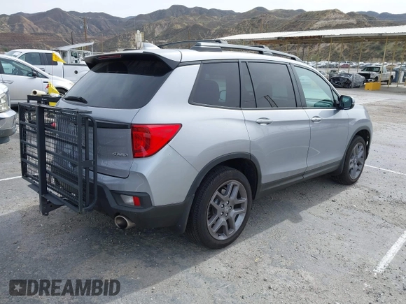 2023 Honda Passport EX-L with VIN 5FNYF8H53PB034963, listed as a IAAI auction lot 41686154 with 12,572 mi miles and . Bid and sale history available at carsss.com. Image 4.