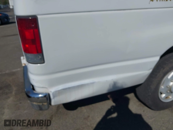 2003 Ford Econoline Passenger XL with VIN 1FBSS31LX3HA18982, listed as a IAAI auction lot 42149360 with 196,201 mi miles. Bid and sale history available at carsss.com. Image 6.