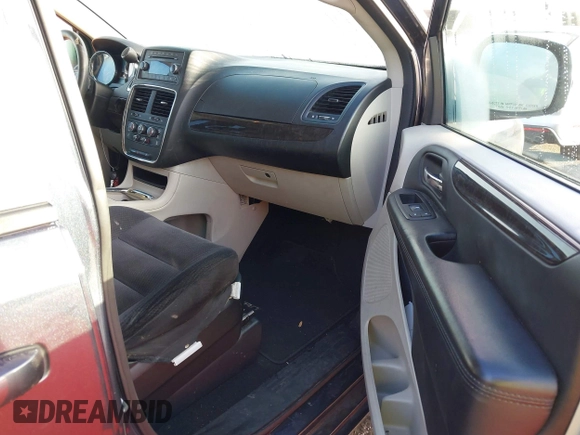 2014 Dodge Grand Caravan SXT with VIN 2C4RDGCG2ER267358, listed as a IAAI auction lot 41001692 with 186,763 mi miles and . Bid and sale history available at DreamBid. Image 5.