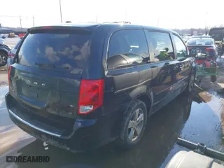 2014 Dodge Grand Caravan SXT with VIN 2C4RDGBG7ER197065, listed as a IAAI auction lot 41674441 with 233,065 mi miles. Bid and sale history available at carsss.com. Image 4.