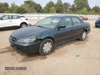 1999 Honda Accord LX with VIN 1HGCG5645XA144908, listed as a Copart auction lot 58783055 with 136,811 mi miles and Salvage title. Bid and sale history available at DreamBid. Image 1.